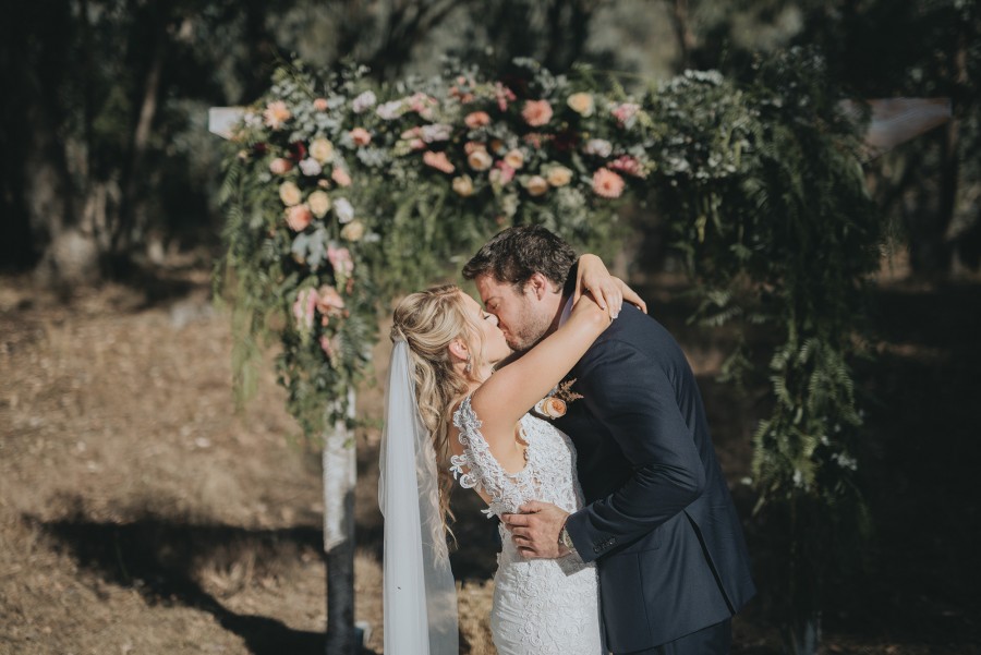 Bride and groom kiss